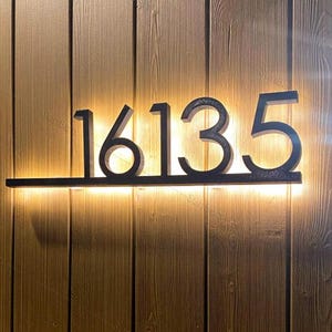 Backlit house numbers sign with color changing dimmable LED for modern mid century home address glowing lit up reverse lighting effect