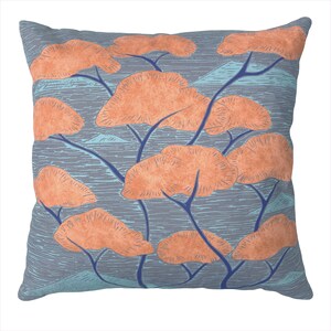 May include: A decorative cushion featuring a blue background with a pattern of orange trees. The trees have a stylised, almost abstract design.