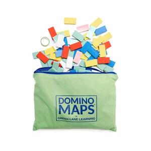 May include: A light green fabric pouch with a blue zipper, featuring the text "DOMINO MAPS by GREEN LANE LEARNING" in blue. A collection of small, rectangular wooden dominoes in red, yellow, blue, white, and light green are spilling out of the top.