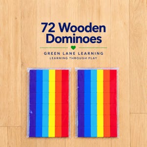 May include: Two clear plastic bags containing 72 wooden dominoes arranged in vertical columns of purple, blue, light blue, yellow, orange, and red. The text 72 Wooden Dominoes, Green Lane Learning, and Learning Through Play is printed above.