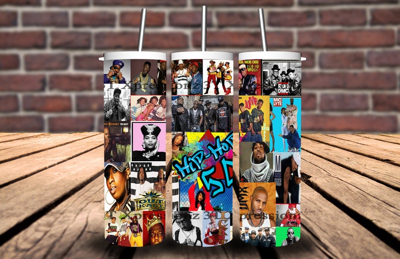 May include: Three white tumblers with lids and straws, each featuring a different collage of hip-hop album covers from the 1980s and 1990s. The collages include images of artists such as Run-DMC, Salt-N-Pepa, LL Cool J, and more.