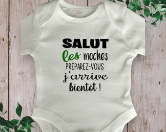 Bodies Humorous unisex baby bodysuit ideal for announcing a pregnancy "Hello Ugly Ones Get ready I'm coming soon!"