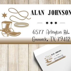 May include: A white return address label with a brown cowboy boot, lasso, and star design. The text on the label reads "ALAN JOHNSON - *** - 6577 Arlington Rd. Commack, TX 79412".