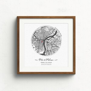 May include: A black and white map print of Philadelphia, Pennsylvania with a red dot marking the location of "Where it all began." The print is framed in a light brown wood frame.