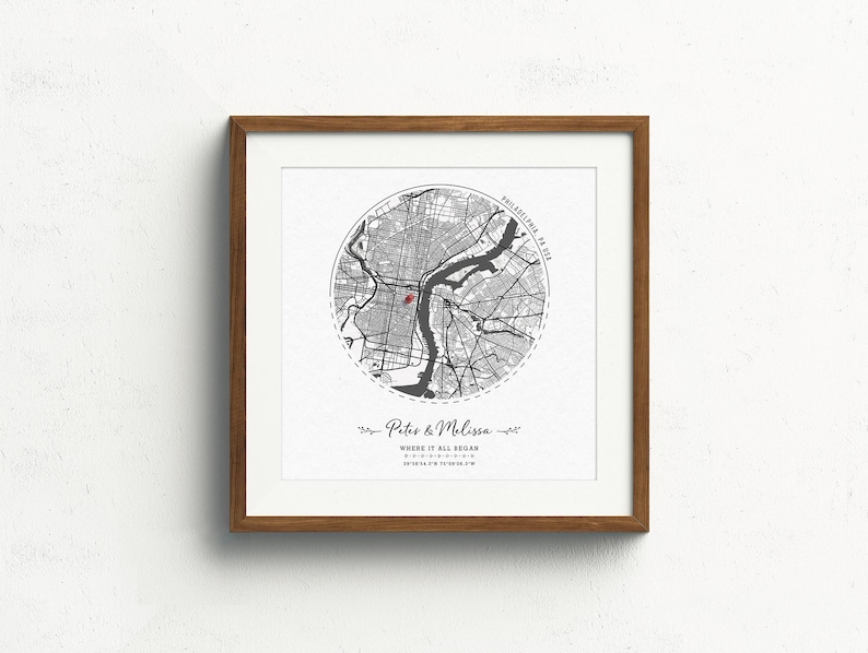May include: A black and white map print of Philadelphia, Pennsylvania with a red dot marking the location of "Where it all began." The print is framed in a light brown wood frame.