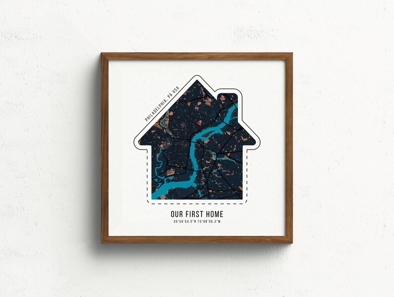 May include: A framed print with a white house outline filled with a map of Philadelphia, Pennsylvania. The text "OUR FIRST HOME" is below the map with the coordinates 39.9526&deg; N 75.1652&deg; W.