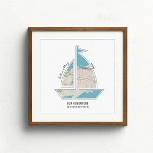 May include: A framed print of a sailboat with a map of a city inside. The text "Our Adventure" is below the map, and the text "William & Mary" is on the left side of the map.