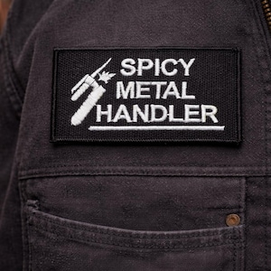 Toppa morale per saldatori con manico in metallo piccante