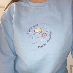 Embroidered sweatshirt - Shifting to another reality sweatshirts / sweaters / crewnecks (light blue)