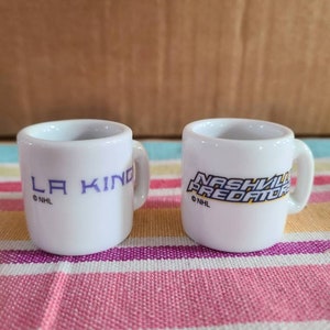 Set of 2 Vintage miniature porcelain NHL mugs.