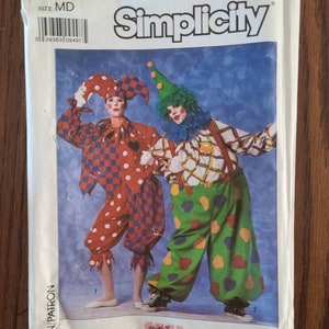 May include: Simplicity sewing pattern number 9344 for size MD. The pattern includes instructions for making two clown costumes. One costume is a jester with a red, white, and black checkered pattern and a red and white polka dot pattern. The other costume is a traditional clown with a green, yellow, and red heart pattern. The pattern is from Shirley Bedford.