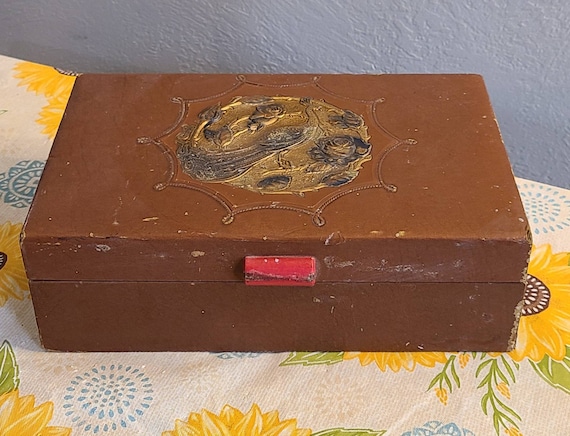 Vintage jewelry box with mirror inside.