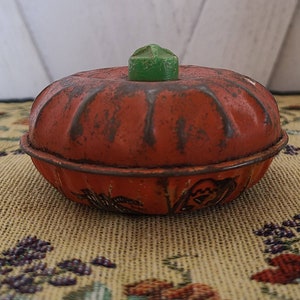 Vintage Metal Pumpkin Noise Maker Toy.