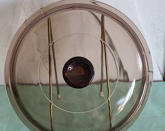 Brown Glass Pyrex lid with handle.