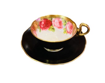 As is Royal Albert Crown China black with pink roses tea cup and saucer with heavy gold trim England, older collectible tea cup set.