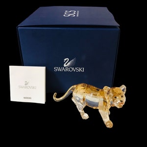 Collectible Swarovski Crystal figurine Tiger cub walking golden shine signed by designer, made in Austria, new in original box.