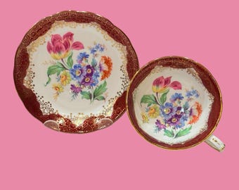 Conjunto de xícara e pires Hammersley com estampa floral, em porcelana fina, Inglaterra.