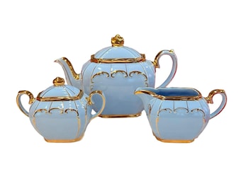Vintage Sadler cube tea pot with creamer and sugar bowl with blue and gold England. Collectble.