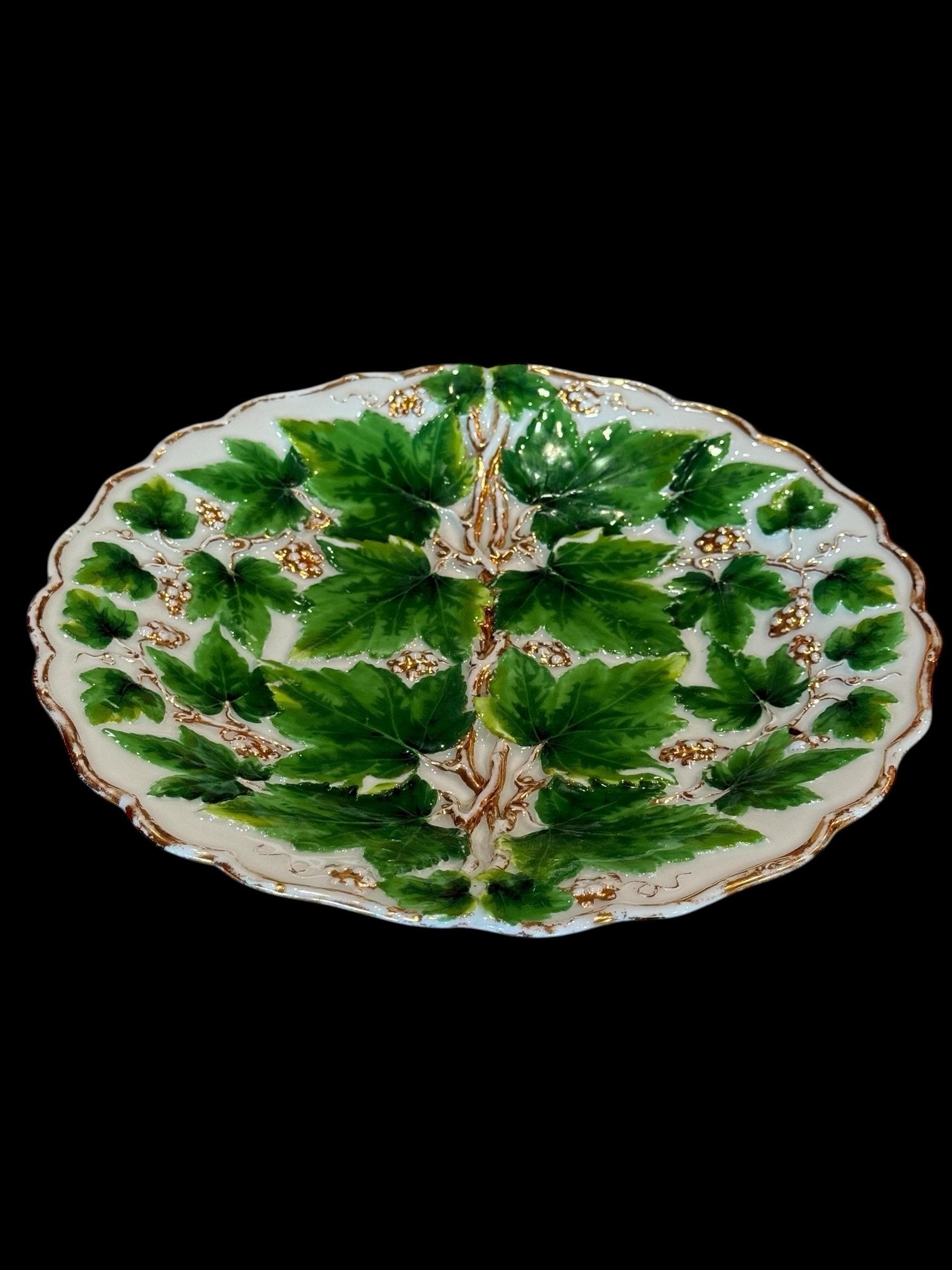 Highly Collectible Meissen 19th century Germany porcelain large plate 9 7/8” diameter green vine leaves and gilt with grapes motifs.