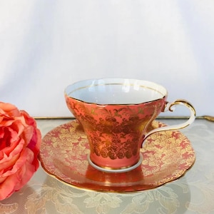 Aynsley corset orange and gold tea cup and saucer, corset shaped teacup