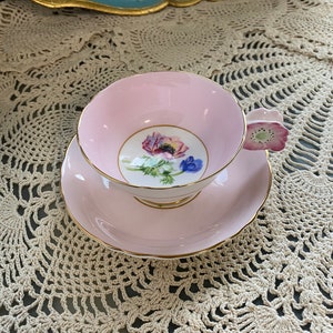 As is rare double warrant pink paragon flower handled tea cup and saucer with poppy anemone centre, unique paragon handle cup