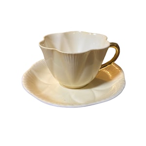 Vintage Shelley light yellow dainty shaped tea cup and saucer with gold handle, pure colours Shelley, collectible bone china