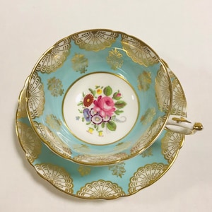 Beautiful Paragon turquoise blue bone china tea cup and saucer, by appointment to her Majesty’s Queen. Floral design, gift for her