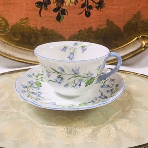Collectible Shelley Harebell Round Shaped Floral Design and Blue Trim Handle tea Cup And Saucer. Fine bone china England. Collectible gift.