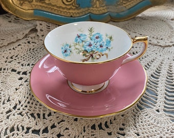 Vintage aynsley pink exterior tea cup and saucer with blue flowers and bow tie, bone china aynsley