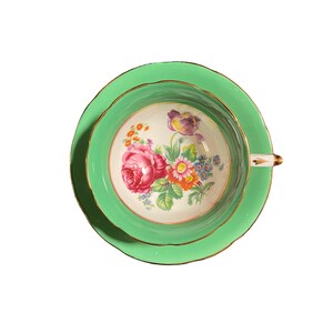 Vintage paragon tea cup and saucer with pink floral centre and green border