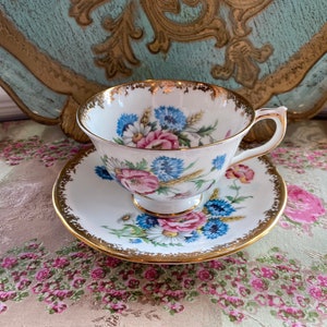 Aynsley tea cup and saucer gold trims and pink flowers with wheat