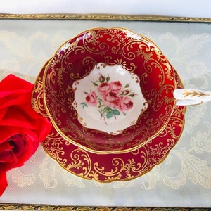 Stunning rare red royal Stafford tea cup and saucer with pink bridesmaid rose Centre