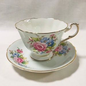 Beautiful pale blue Paragon bone china England tea cup and saucer with pink roses, floral design, gift for her
