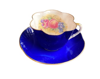 Vintage crown Staffordshire Bailey signed fruit tea cup and saucer with cobalt blue exterior