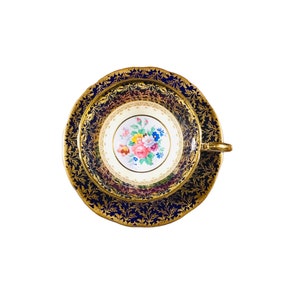 Beautiful vintage Aynsley cobalt blue with heavy gold leaves and central flowers tea cup and saucer, bone china England, mint condition.