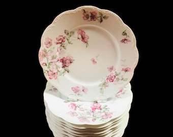 Price for Each.. Limoges Haviland “The Miramar“ scalloped dinner plate 9 3/4” diameter with hand painted pink flower.
