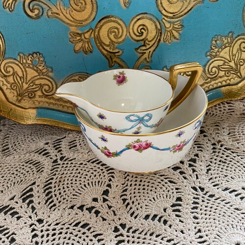 As is crown Staffordshire blue ribbon Handpainted bow tie swag shops cream and sugar set