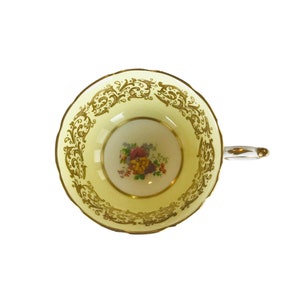 Vintage replacement double Paragon yellow with central flowers cup orphan bone china England , replacement Paragon cup.