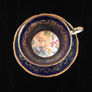 Beautiful Aynsley cobalt blue tea cup and saucer with scenery pattern and gold scrolls, collectible vintage English teacup gift