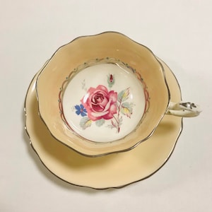 As is Gorgeous vintage paragon cabbage rose tea cup and saucer, By appointment to H.M.The Queen and H.M Queen Mar . Bone china, England.