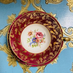 Burgundy red Stanley tea cup and saucer with pink floral centre and gold handle, English bone china gift