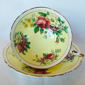 Vintage paragon pink rose tea cup and saucer on yellow background, English bone china tea cup gift