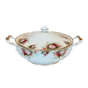 May include: White porcelain soup tureen with a lid and two handles. The tureen is decorated with a floral pattern of pink, red, and white roses.