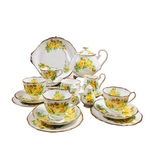royal Albert made in England “tea rose” yellow rose afternoon tea set of 20 pieces for 4,  small teapot, 4 trios , creamer sugar bow….