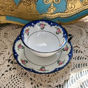 Unique vintage Tuscan black handle blue edge pink rose tea cup and saucer, English bone china