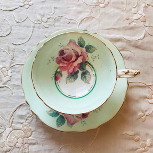 As is are double warrant green Paragon Big with large pink cabbage rose tea cup and saucer, collectible paragon tea set