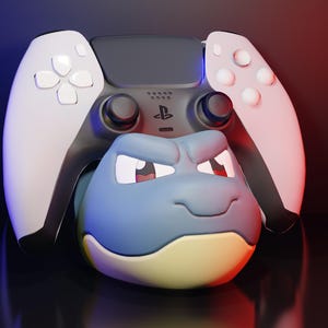 May include: A custom PlayStation 5 controller with a blue and yellow Blastoise design. The controller has white side panels and a black center section. The Blastoise character is centered on the controller.