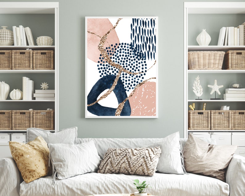 May include: Abstract art print with a white backdrop, navy blue, blush pink, and gold glitter details. The design incorporates geometric shapes and dotted patterns, offering a modern aesthetic. The artwork is framed in a white border.