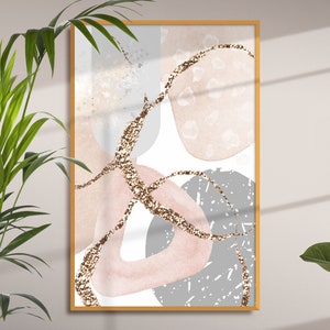 K&ouml;nnte beinhalten: Abstrakter Kunstdruck mit rosa, grauen und goldenen Formen auf wei&szlig;em Hintergrund. Der Druck ist in einem goldenen Rahmen gerahmt.