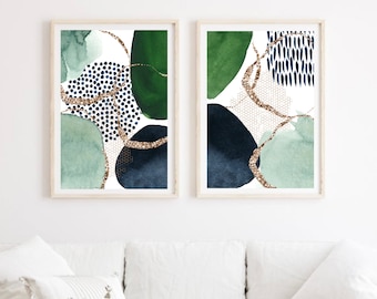 May include: Two abstract art prints with a white background, featuring green, blue, and gold watercolor shapes and patterns.